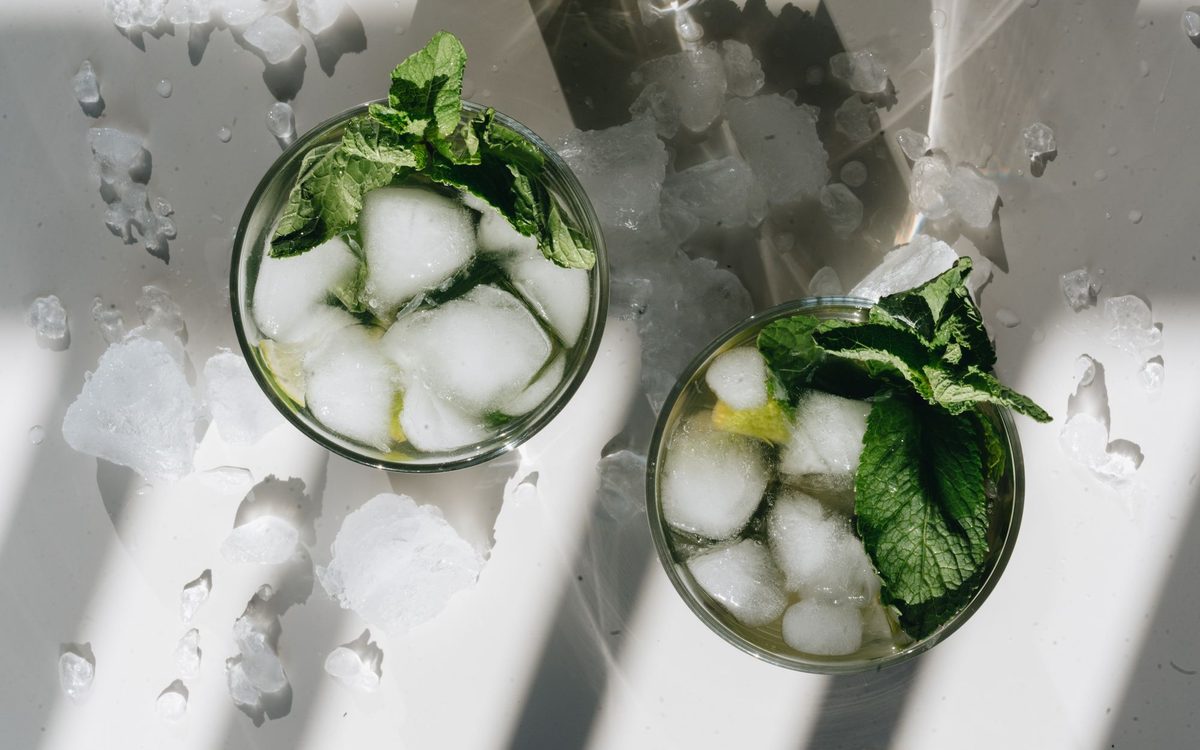 Overhead shot of mojito cocktails with ice and mint leaves, the kind of drinks a nugget ice maker is bought for.