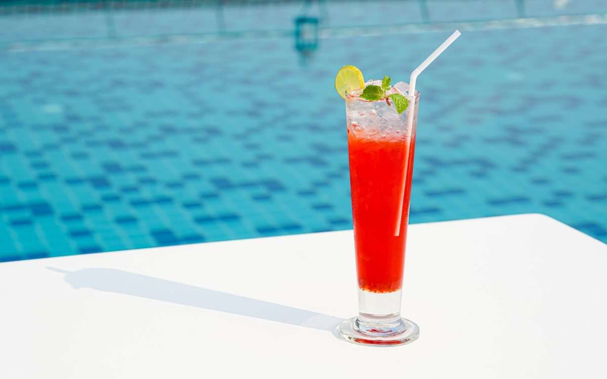 Strawberry cocktail packed with ice and mint, the kind of tall drink that suits nugget ice